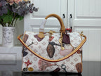 Louis Vuitton monogram tote handbag with top handles and colorful charm details