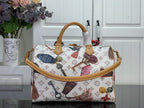 Louis Vuitton monogram tote handbag with two top handles and hanging accessories