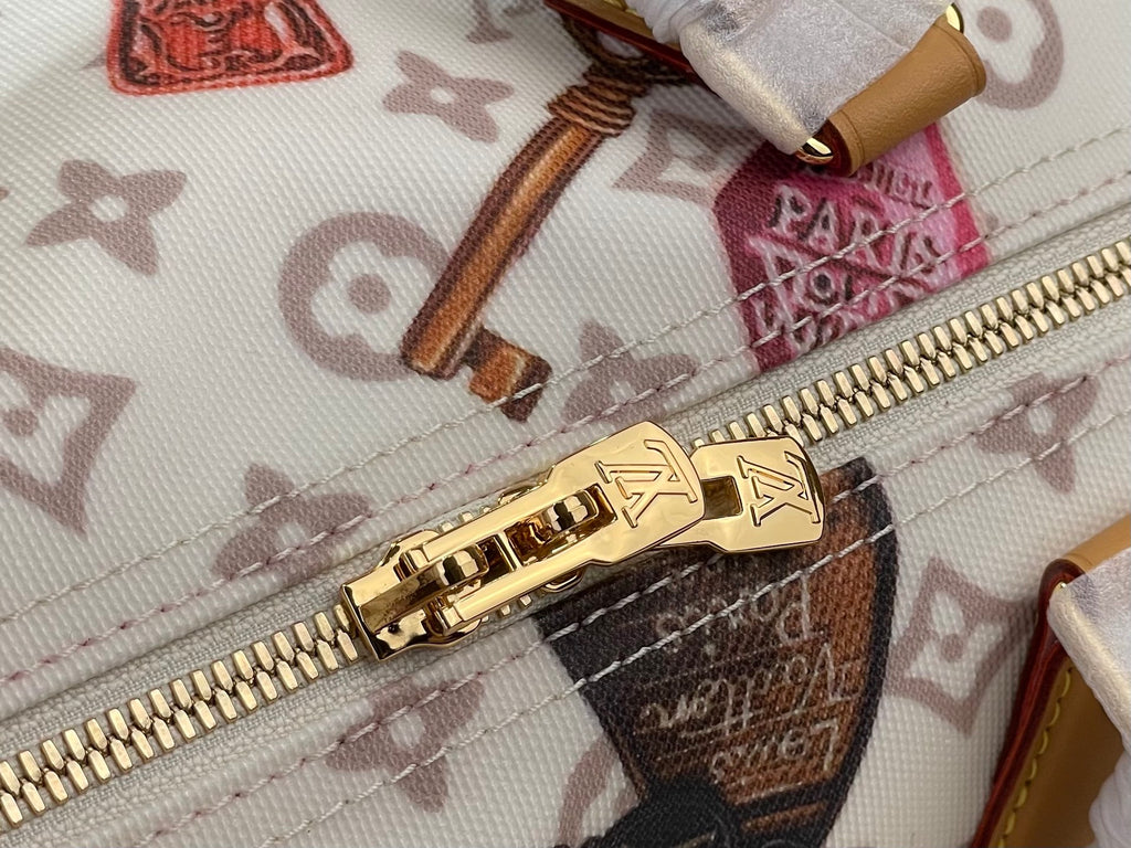 Louis Vuitton zipper pull and track with gold hardware on monogram handbag