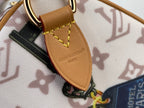 Louis Vuitton leather strap tab with logo on monogram handbag, stitched edge detail