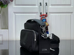 Louis Vuitton crossbody bag side view with zip pockets and adjustable shoulder strap