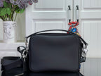 Louis Vuitton crossbody bag with curved front flap, silver hardware, and zipper