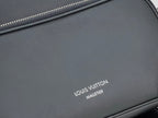 Louis Vuitton “MALETIER” logo on dark black leather bag front panel