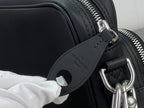 Louis Vuitton crossbody bag close-up of zipper track and leather strap ring