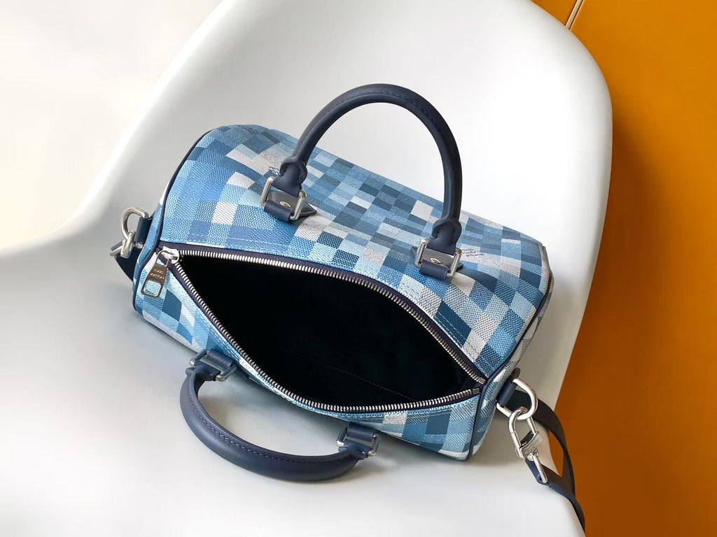 Blue checkered handbag with open zip top showing black interior