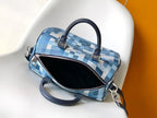 Blue checkered handbag with open zip top showing black interior