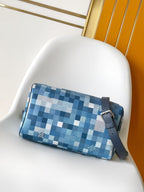 Blue checkered zip handbag with navy crossbody strap and metal buckle