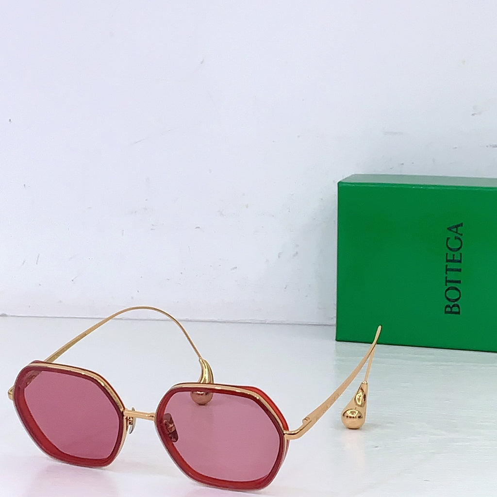 Bottega Veneta sunglasses with pink tinted lenses and red frame with gold-toned trim
