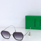 Bottega Veneta sunglasses with dark purple tinted lenses and silver-toned metal frame