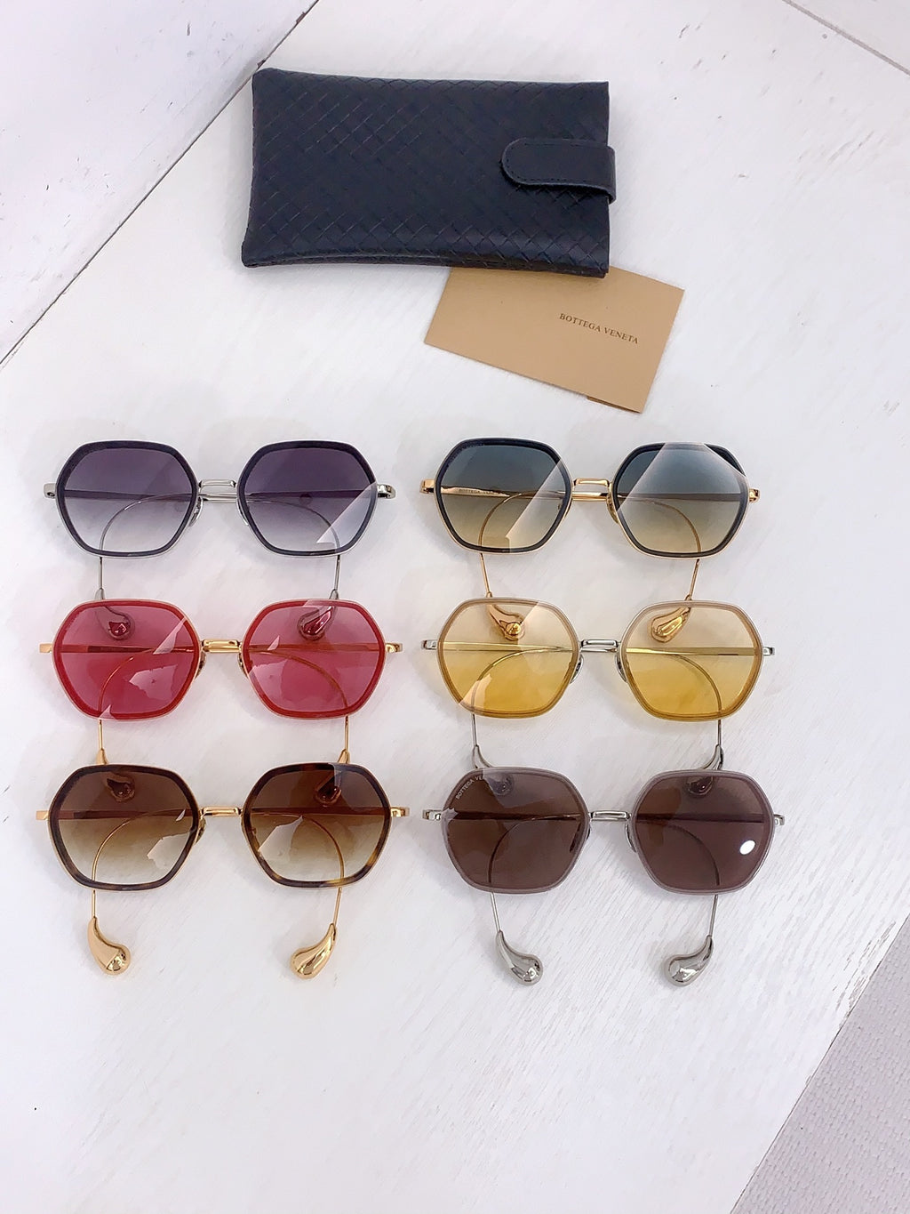 Bottega Veneta sunglasses assortment in purple, yellow, red, tan, and brown frames