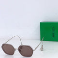 Bottega Veneta sunglasses with brown tinted lenses and light metal frame