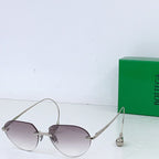 Gold-tone round sunglasses with light brown lenses and slim metal bridge