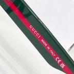 Green temple bar with Gucci Made in Italy and CE markings, red stripe