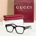 Gucci glasses with black rectangular frames and clear lenses, dark temple arms