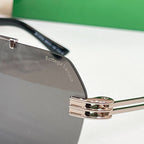 Bottega Veneta sunglasses close-up, metal bridge and temple hinge, engraved temple