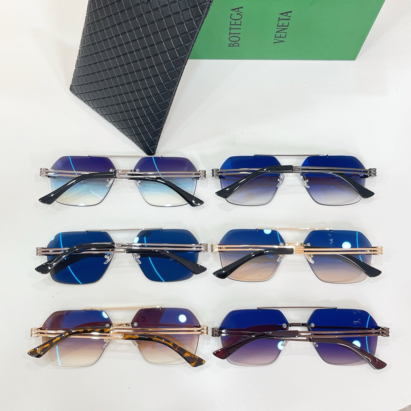 Bottega Veneta sunglasses set, multiple pairs with blue-tinted lenses, with textured black case