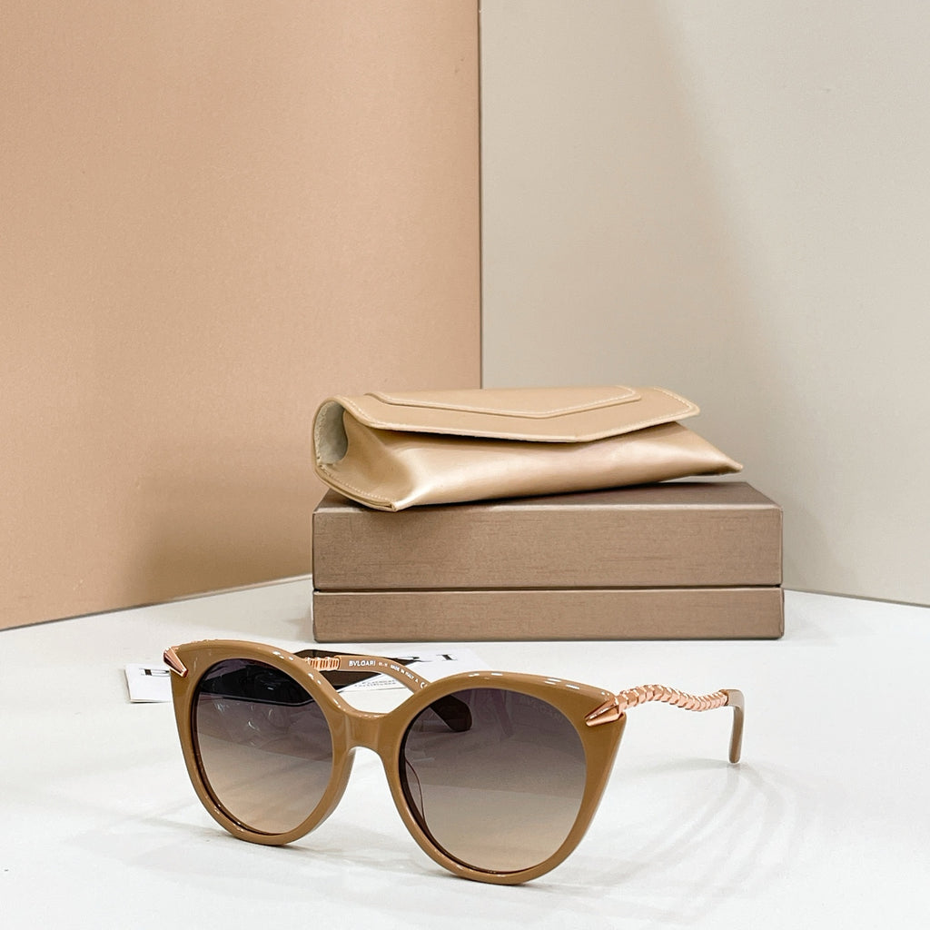 Tan cat-eye sunglasses with gold chain arms and light tinted lenses