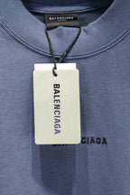 Balenciaga short-sleeve T-shirt with hanging tag at neckline
