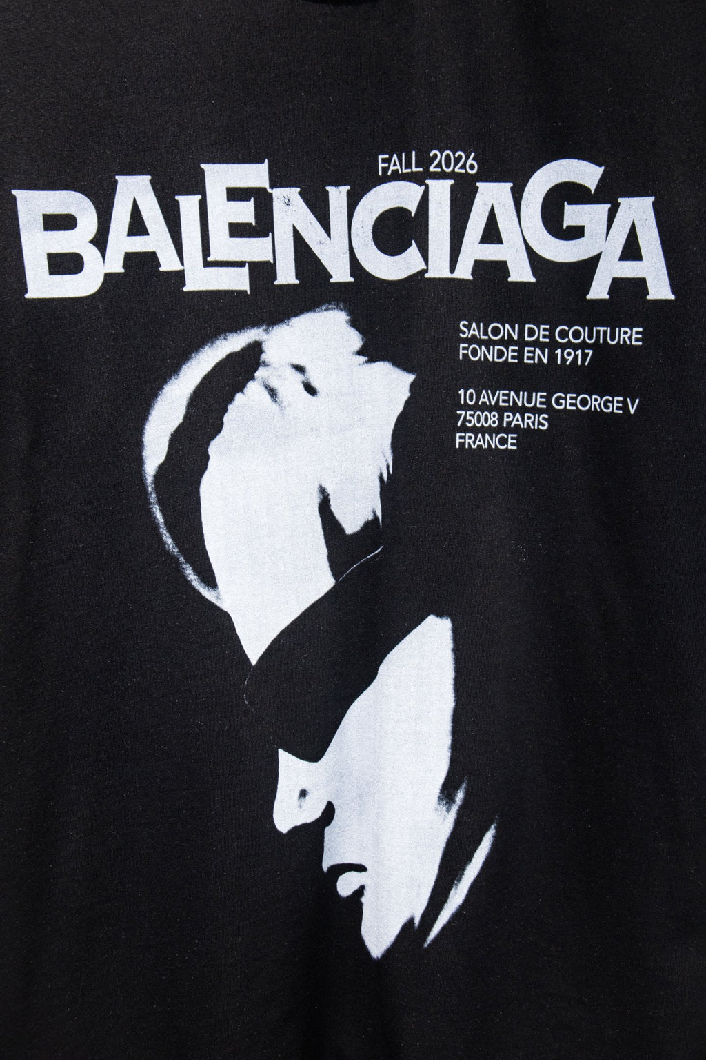 Black T-shirt with BALENCIAGA text and white portrait graphic