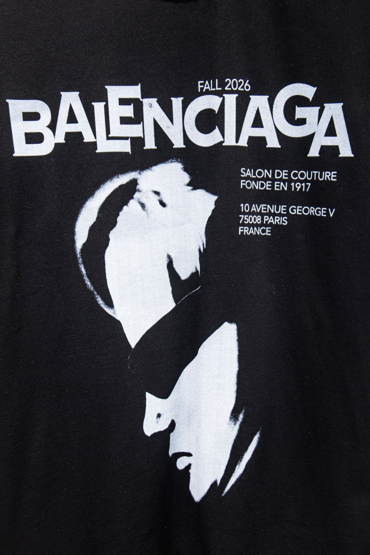 Black T-shirt with BALENCIAGA text and white portrait graphic