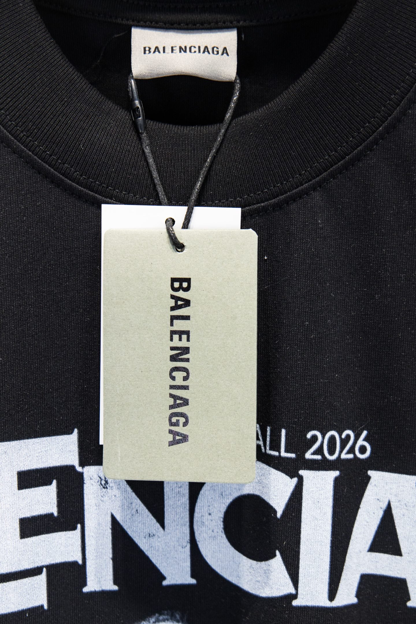 Black T-shirt graphic with Fall 2026, white Balenciaga hang tag