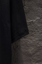 Black short-sleeve T-shirt side hem and seam detail