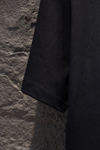 Black short-sleeve T-shirt sleeve and side hem detail