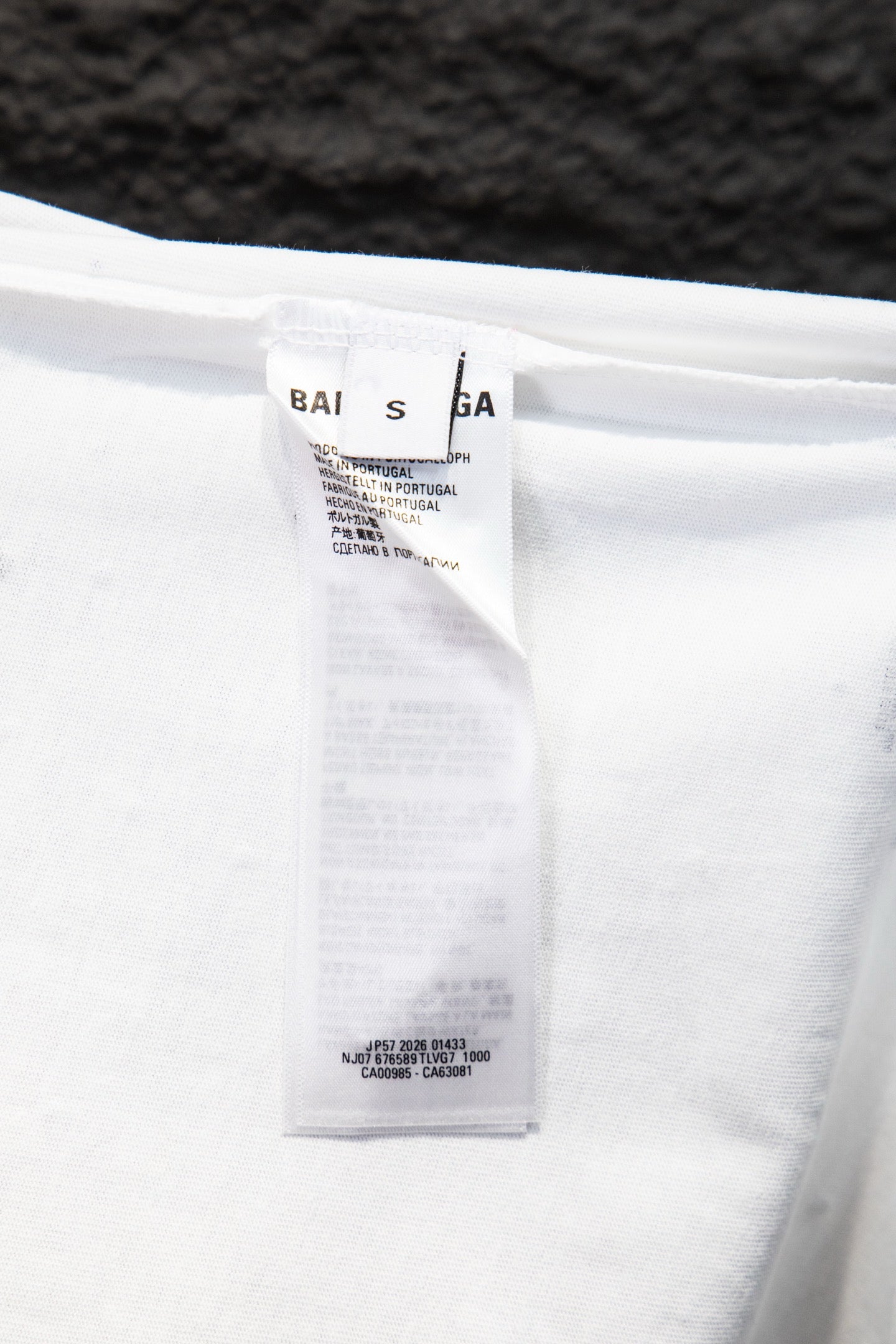 White shirt care label inside collar area