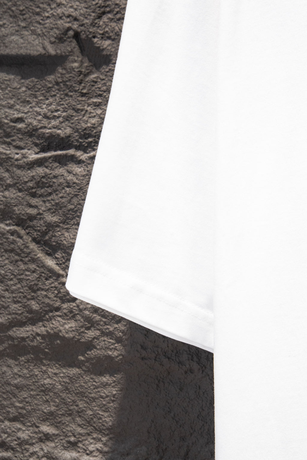 Balenciaga white T-shirt hem, side view
