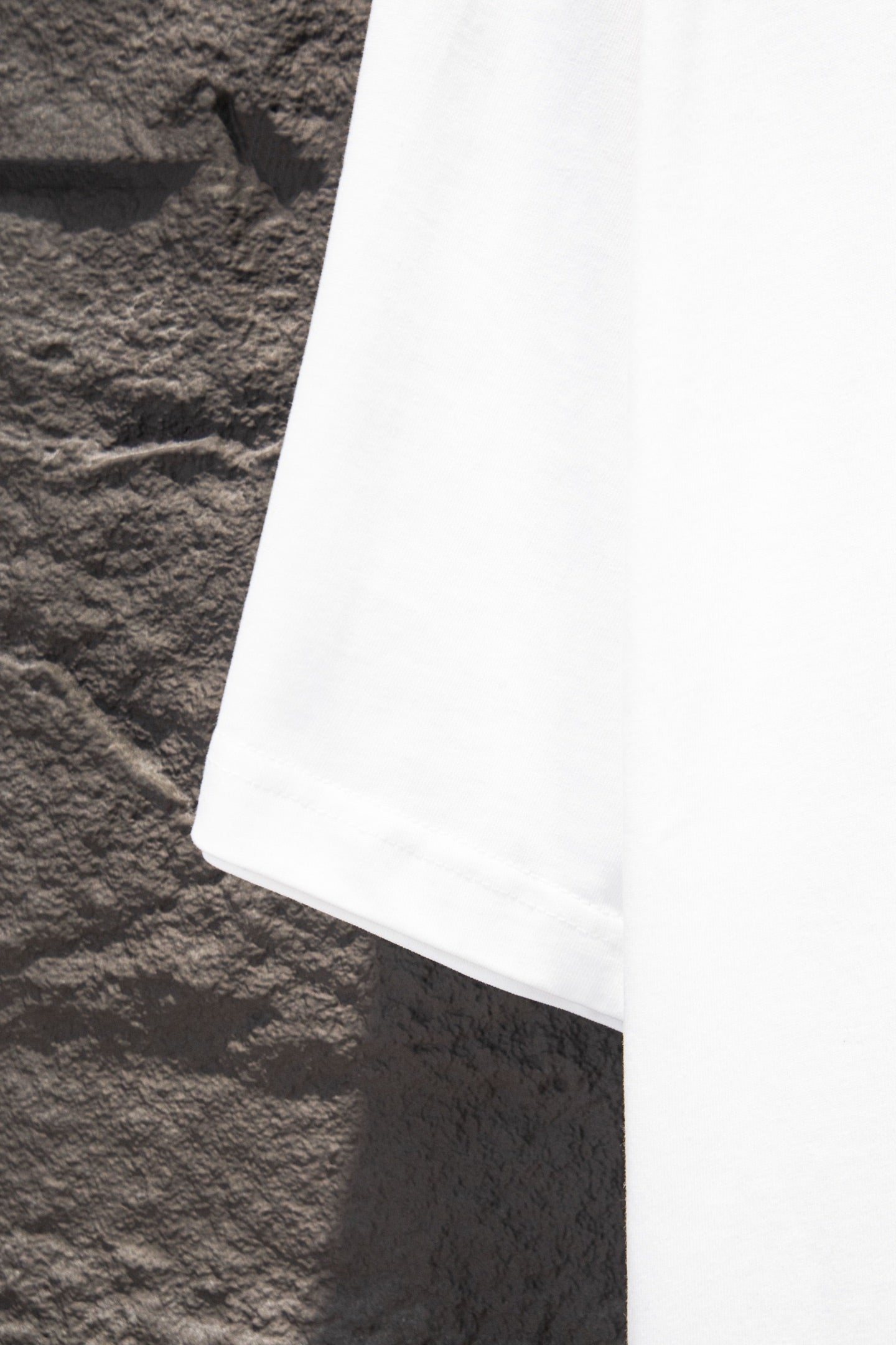 Balenciaga white T-shirt hem, side view