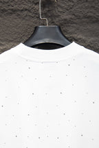 White shirt back neckline with scattered stud-like dots