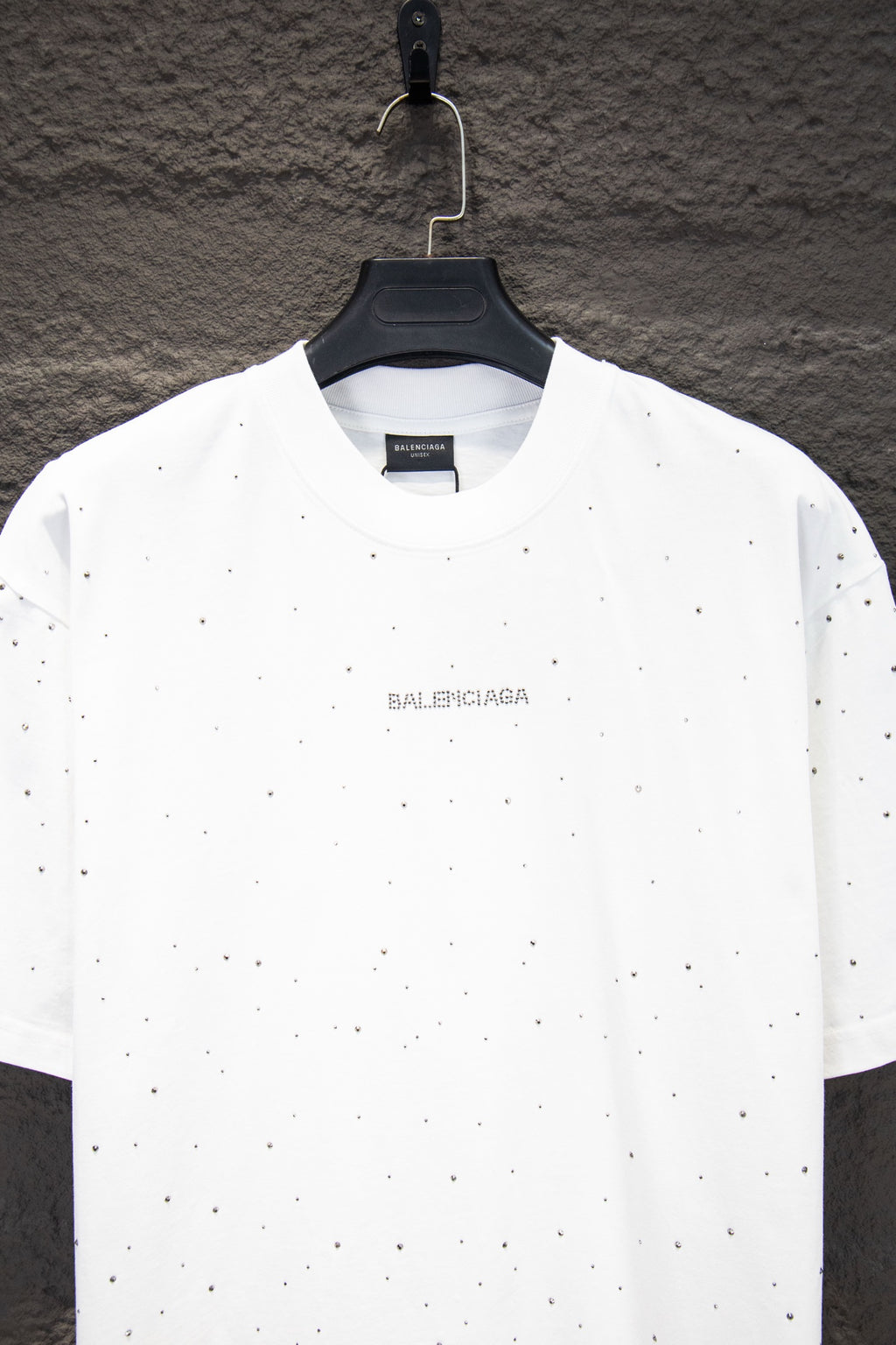 White short-sleeve crewneck shirt with Balenciaga chest logo and scattered stud-like dots