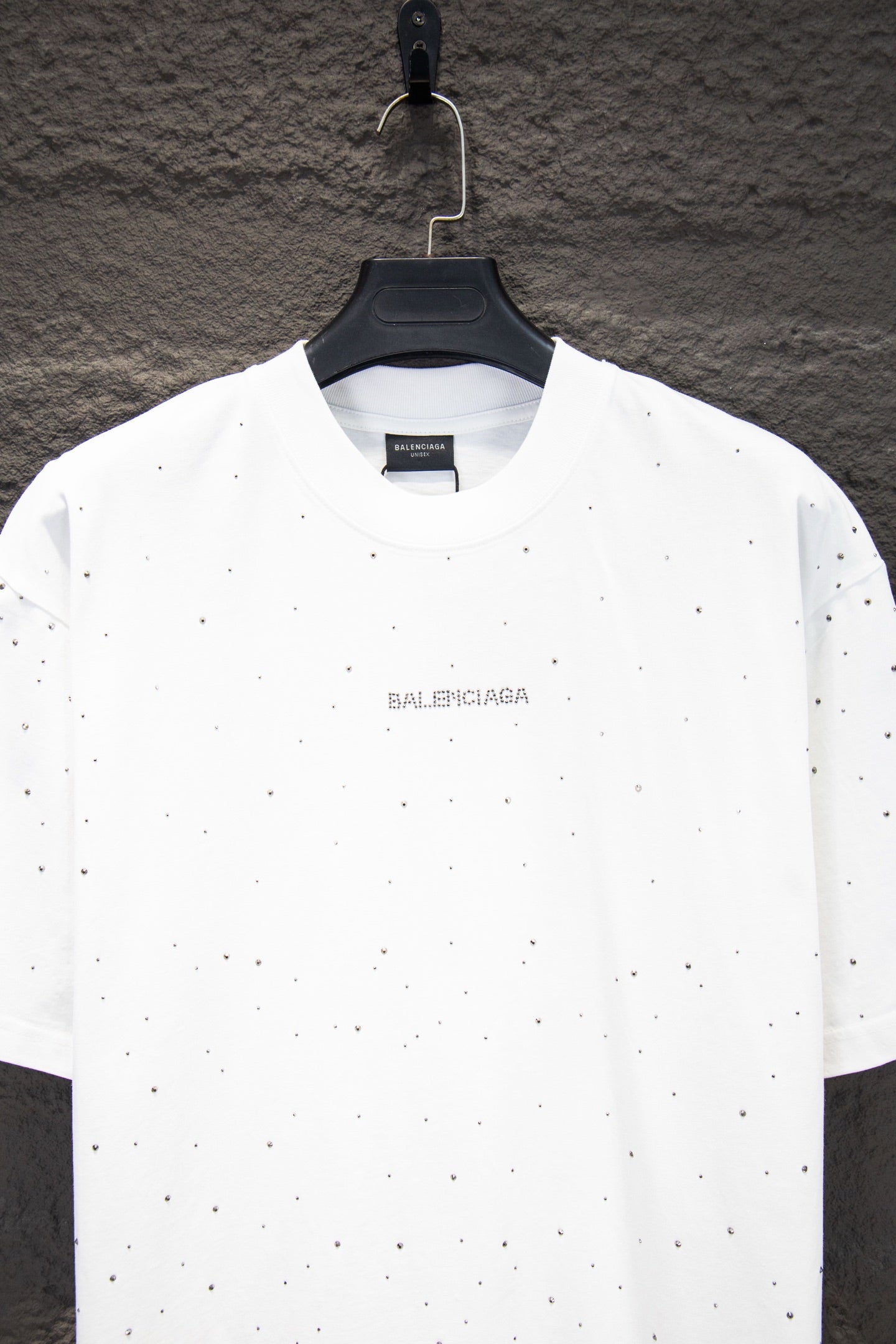 White short-sleeve crewneck shirt with Balenciaga chest logo and scattered stud-like dots