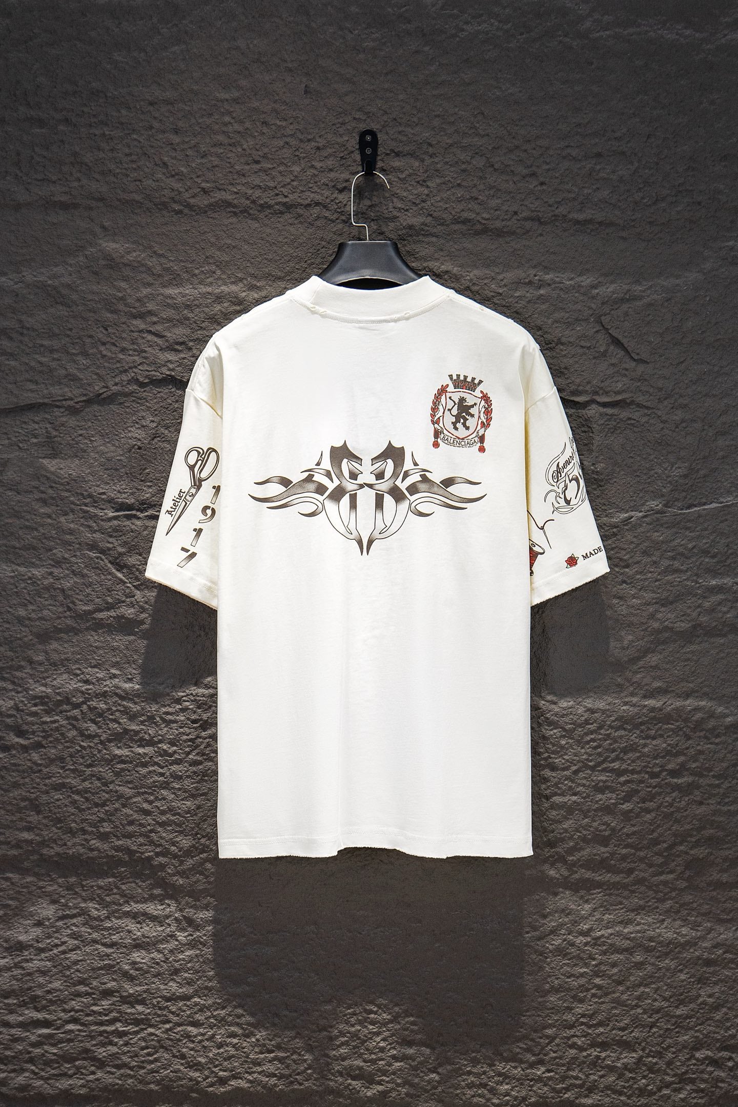 Balenciaga short-sleeve T-shirt, white, back view with large central emblem and crest