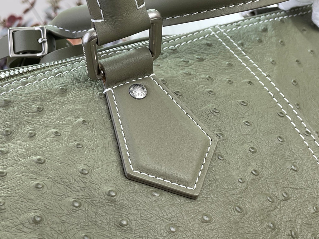 Sage green Louis Vuitton bag strap with silver buckle and stitched edge