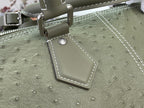 Sage green Louis Vuitton bag strap with silver buckle and stitched edge