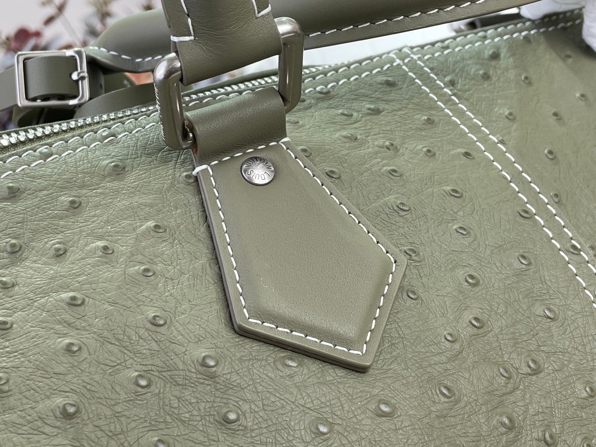 Sage green Louis Vuitton bag strap with silver buckle and stitched edge