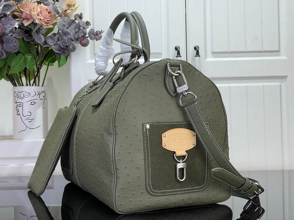 Louis Vuitton olive green bag with front key pouch and shoulder strap