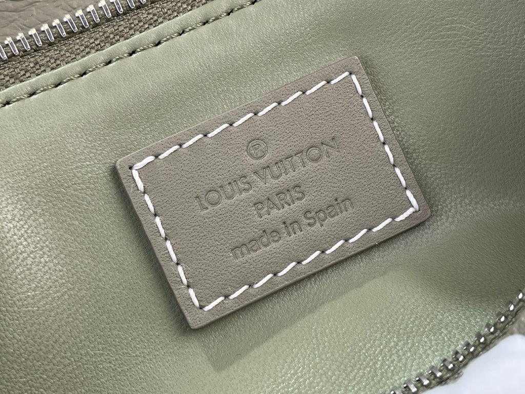 Sage green Louis Vuitton logo leather patch with white contrast stitching