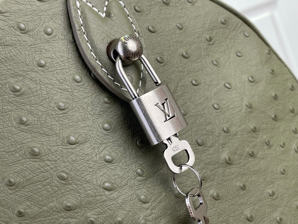 Louis Vuitton olive green bag with engraved padlock charm and D-ring strap