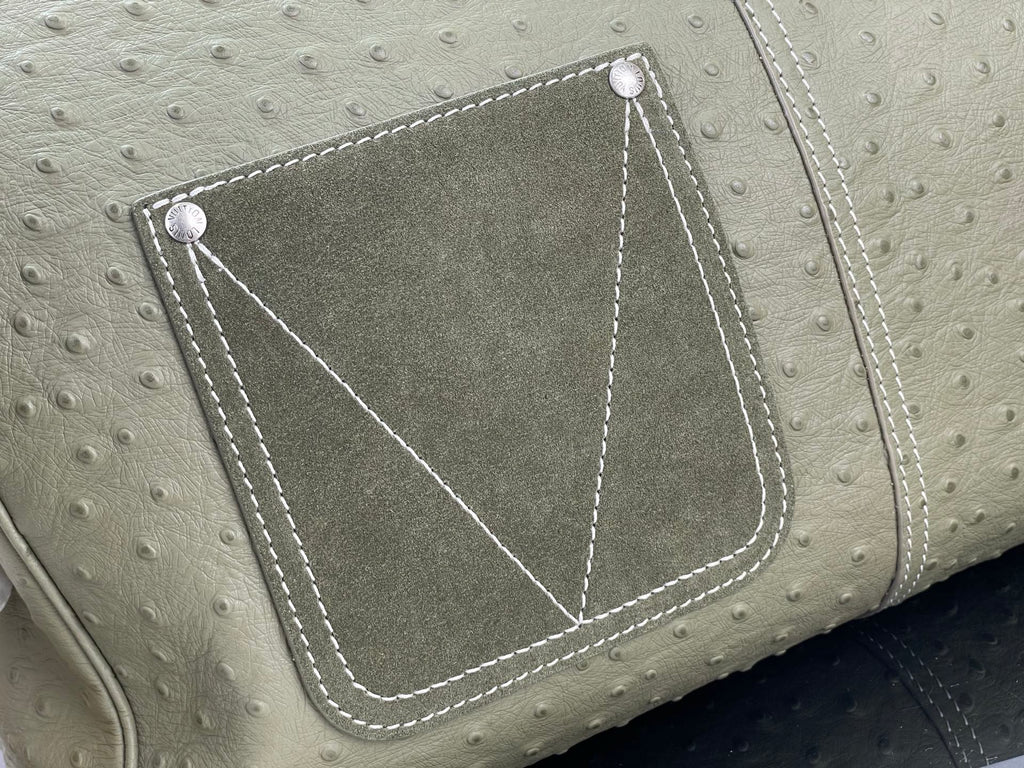 Louis Vuitton olive green front pocket with stitched trim and diamond-style corner seams