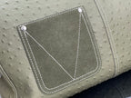 Louis Vuitton olive green front pocket with stitched trim and diamond-style corner seams