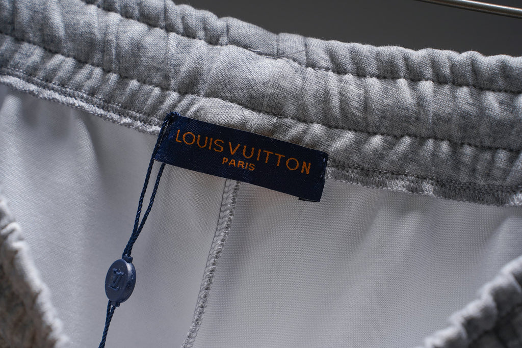 Gray sweat shorts with Louis Vuitton Paris brand label inside waistband