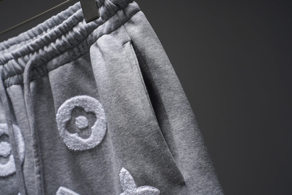 Gray monogram sweat shorts side view with elastic waistband seam