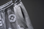 Gray monogram sweat shorts side view with elastic waistband seam