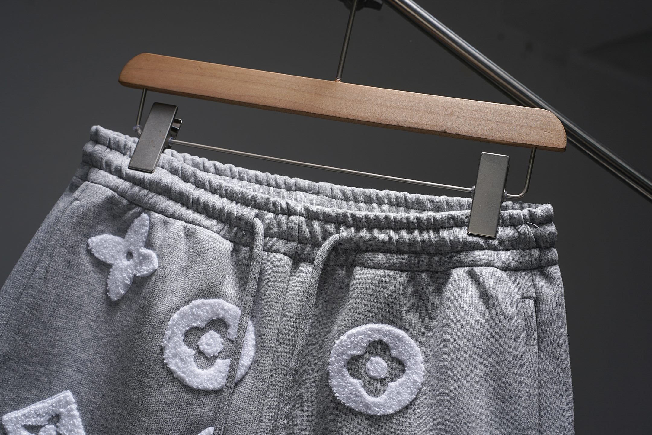Gray monogram sweat shorts close-up, elastic waistband with drawstring, Louis Vuitton