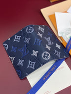 Blue Louis Vuitton small bag with monogram and butterfly pattern, top view