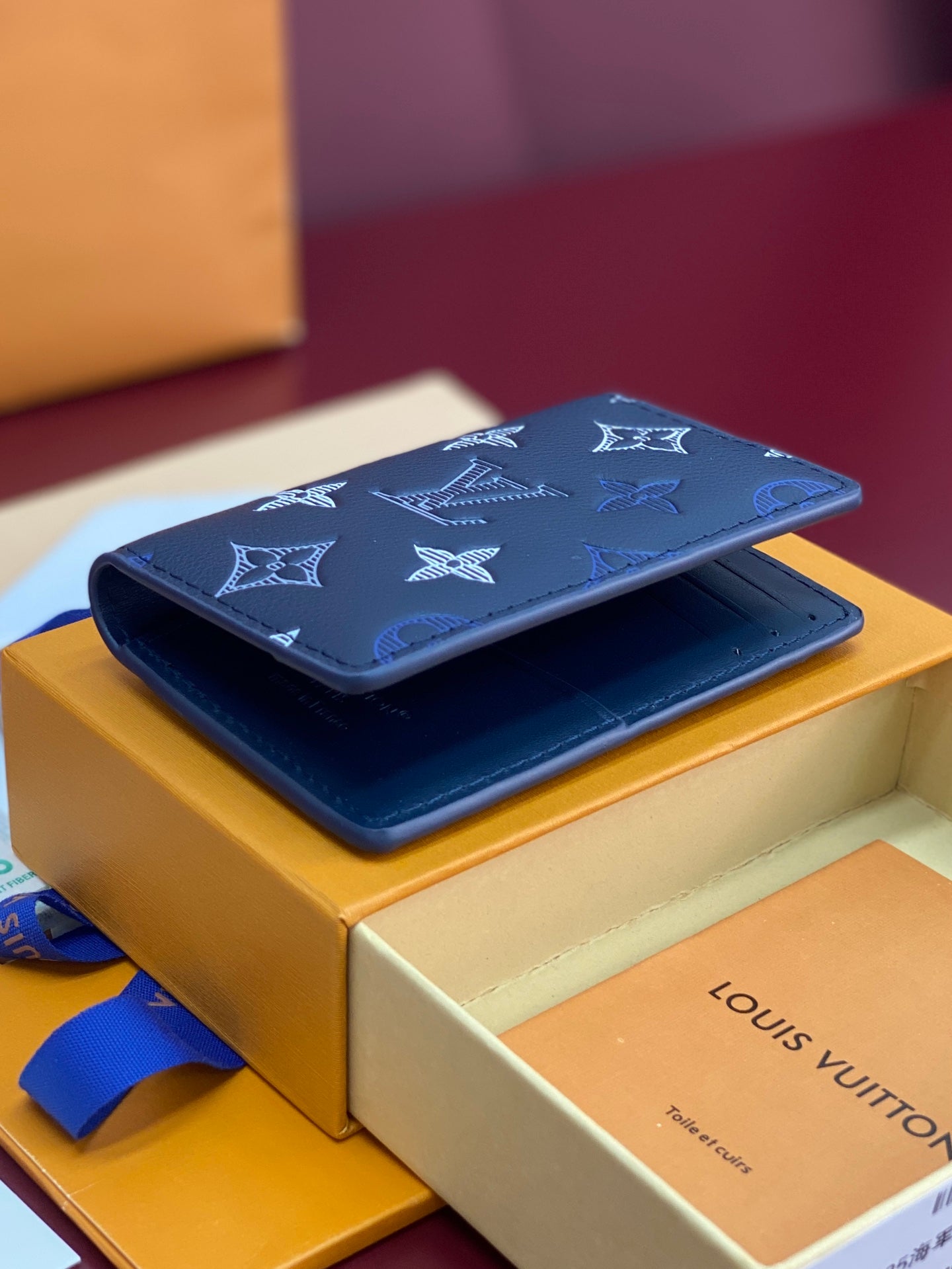 Blue Louis Vuitton small bag set with monogram pattern, on box with folded wallet