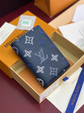 Blue Louis Vuitton small bag with LV and butterfly pattern, front view