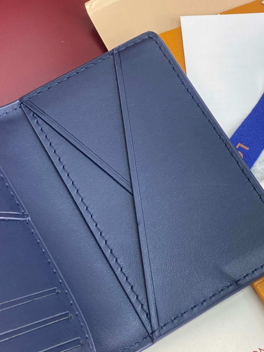 Blue Louis Vuitton small bag interior panel with stitched seams, open view